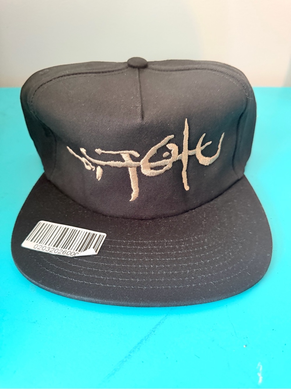 Travis Scott Black Snapback Hat with Tan Embroidered Script